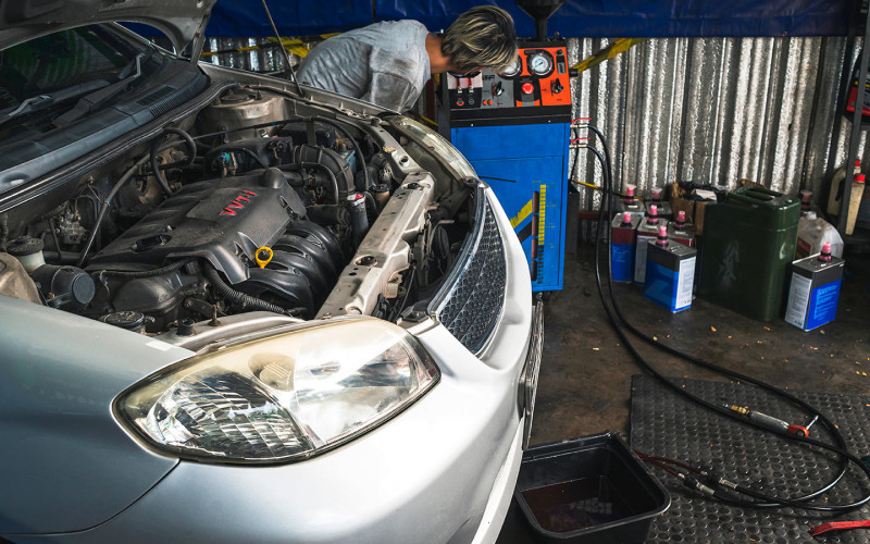 The flush is poured into the oil filler neck and the engine is allowed to run at idle speed